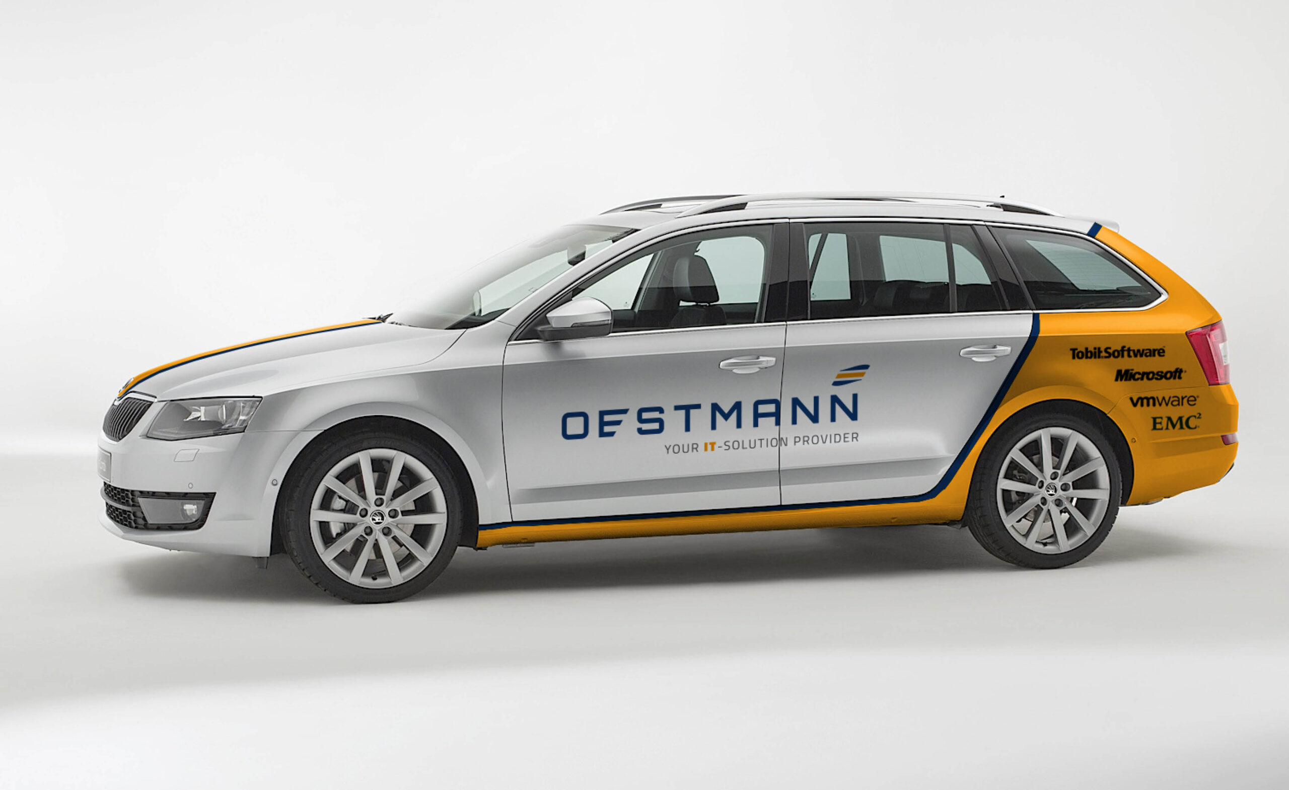 Fahrzeugbeschriftung Oestmann IT-Solution Provider Fahrzeug mit Oestmann IT-Solution Provider Branding in Grau, Blau und Gelb, inklusive Partnerlogos wie Microsoft, VMware und EMC².